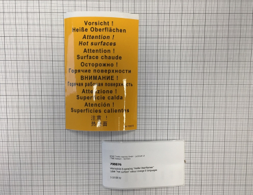 Label "hot surface" colour orange 8 languages