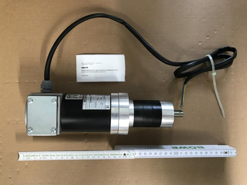 Drive for self cleaning button trap P21-30